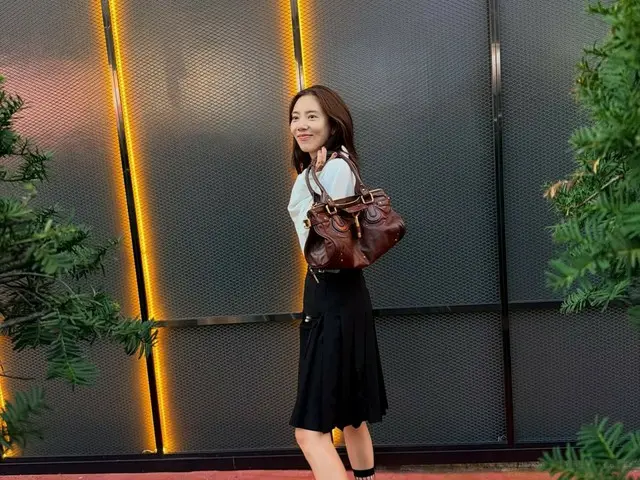 Son Dambi, in between raising his children... mesh socks "This makes me happy"
