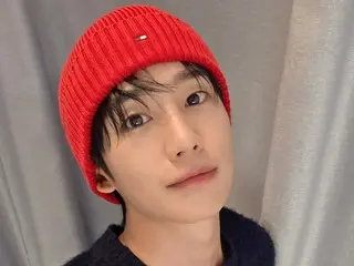 Actor Jung HaeIn shows off his youthful appearance in a red knit cap