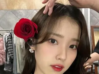 IU looks like a flower...red roses suit her too