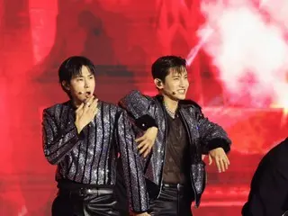 This is "TVXQ" with a handheld microphone and high notes bursting at "2024 KGMA"