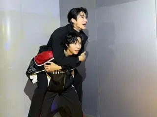 NCT's Johnny takes a photo with Byeon WooSeok on his back... "Run with Seongje on your back"?