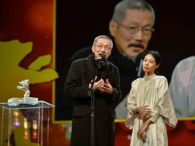 Kim Min Hee and director Hong Sang Soo in Berlin... Check out her bulging belly