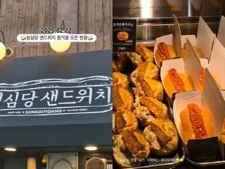 "40 minute wait"... A line at a sandwich shop in Sacred Heart Temple, South Korea