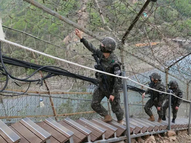 A North Korean resident is on the "military demarcation line" between North and South Korea... South Korean military "detains" him