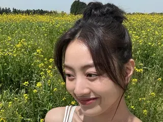 TWICE's JIHYO bursts with fresh charm in a rapeseed field