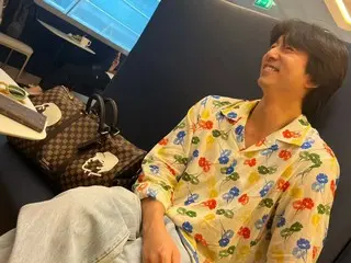 Actor Gong Yoo, with a mischievous smile in a gorgeous floral shirt