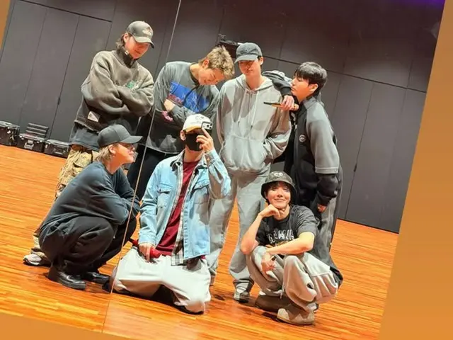 BTS' V releases a photo of the group in the practice room...expectations for their comeback are rising!